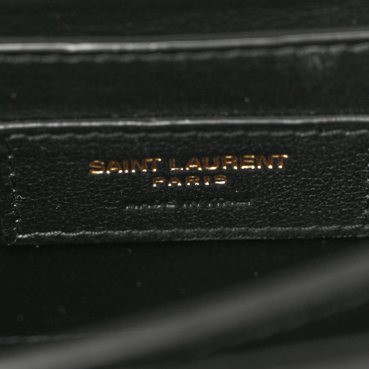 Black leather label reading SAINT LAURENT PARIS on inner lining.