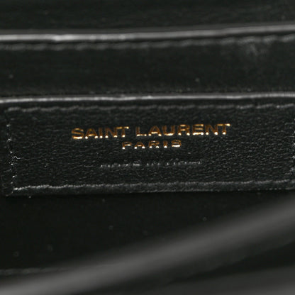 Black leather label reading SAINT LAURENT PARIS on inner lining.