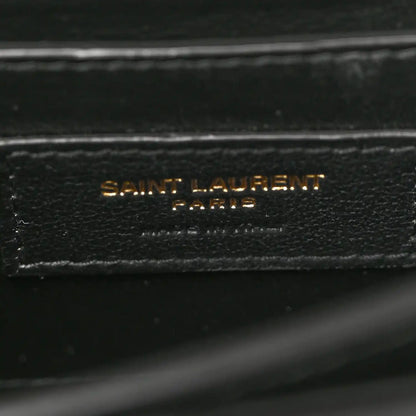 Black leather label reading SAINT LAURENT PARIS on inner lining.