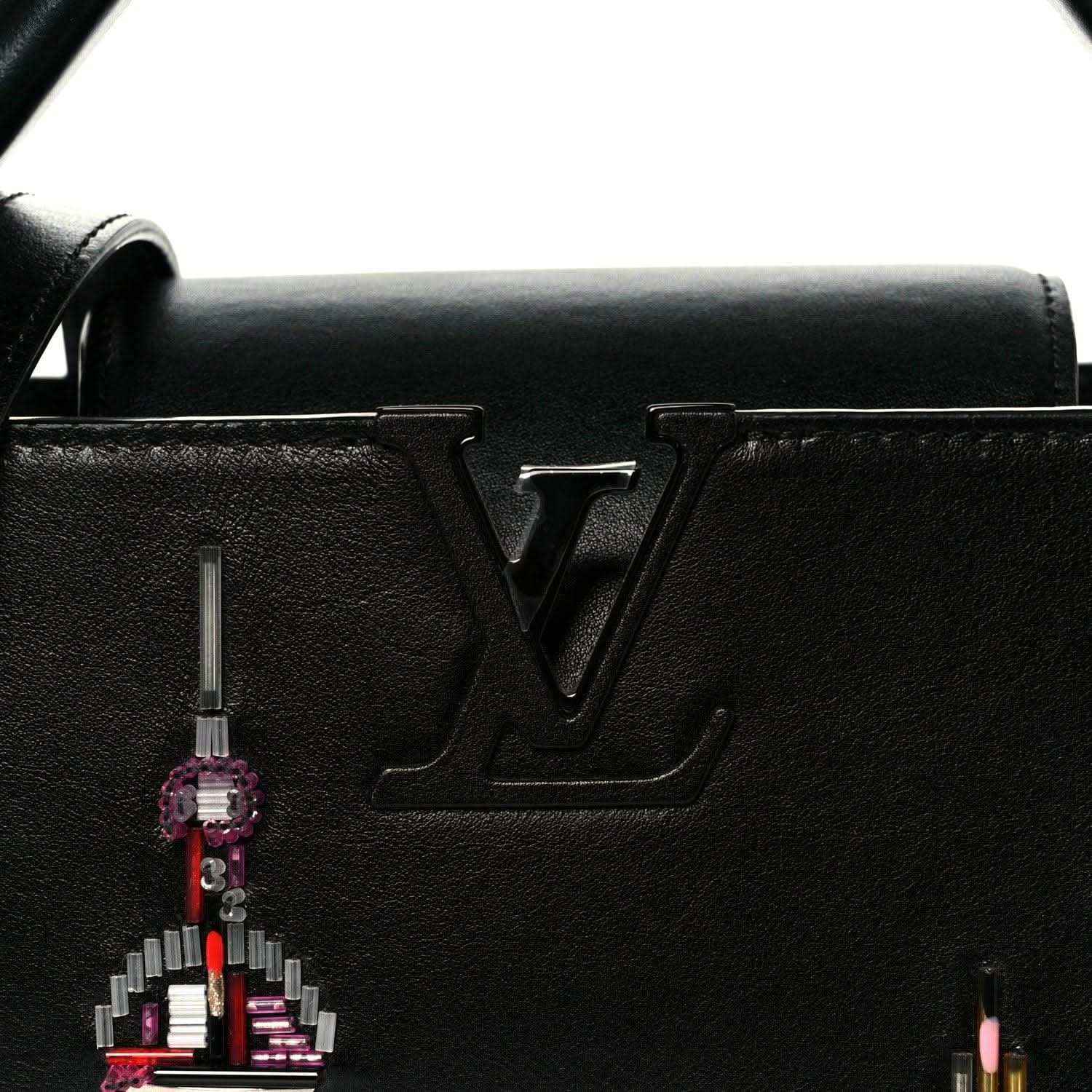 Capucines BB black leather front with LV logo and hanging beaded charm