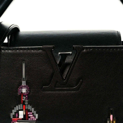 Capucines BB black leather front with LV logo and hanging beaded charm