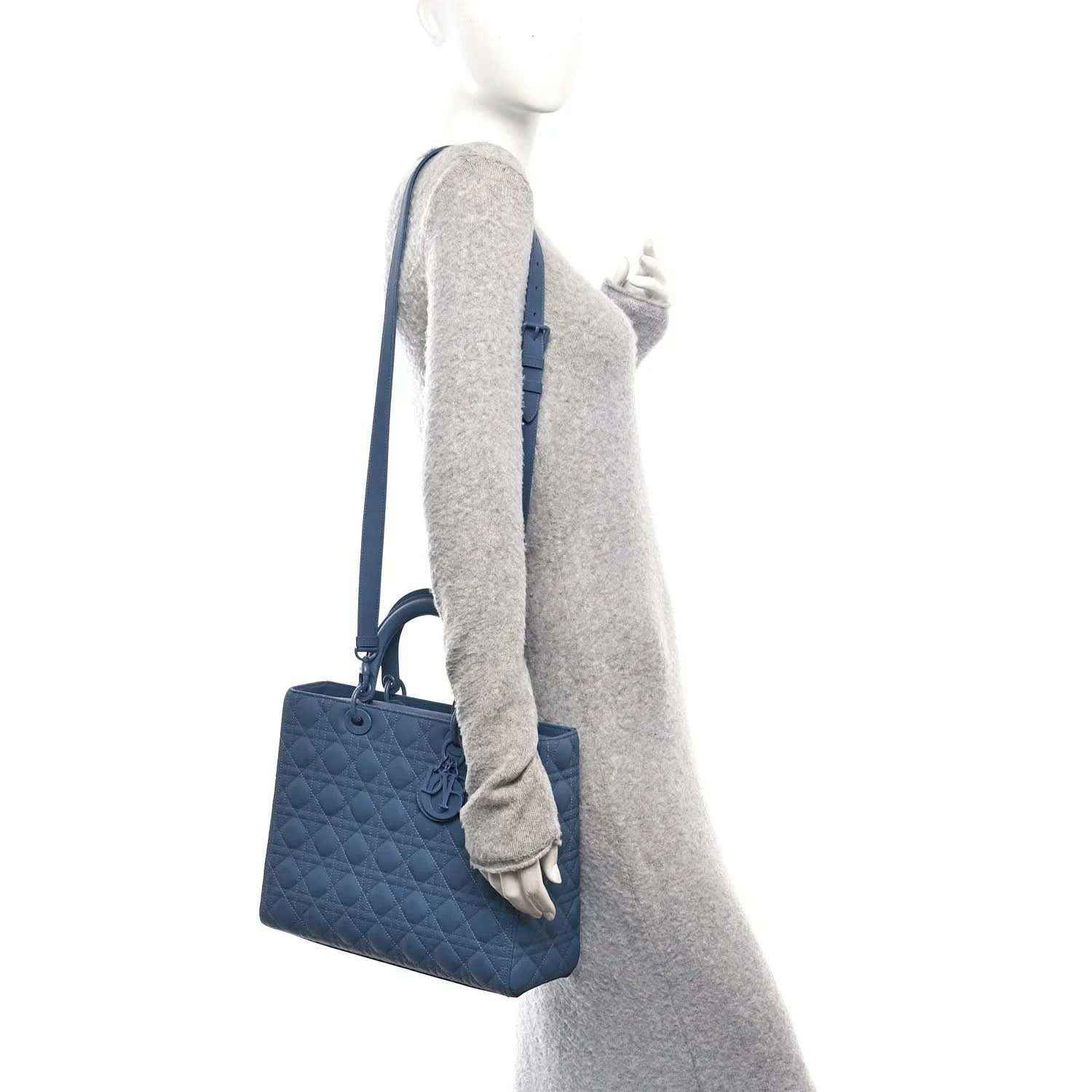 Denim blue quilted Lady Dior bag with shoulder strap, side view