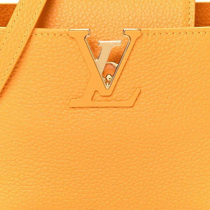 Louis Vuitton handbag in yellow textured leather with gold-tone LV lock ornament
