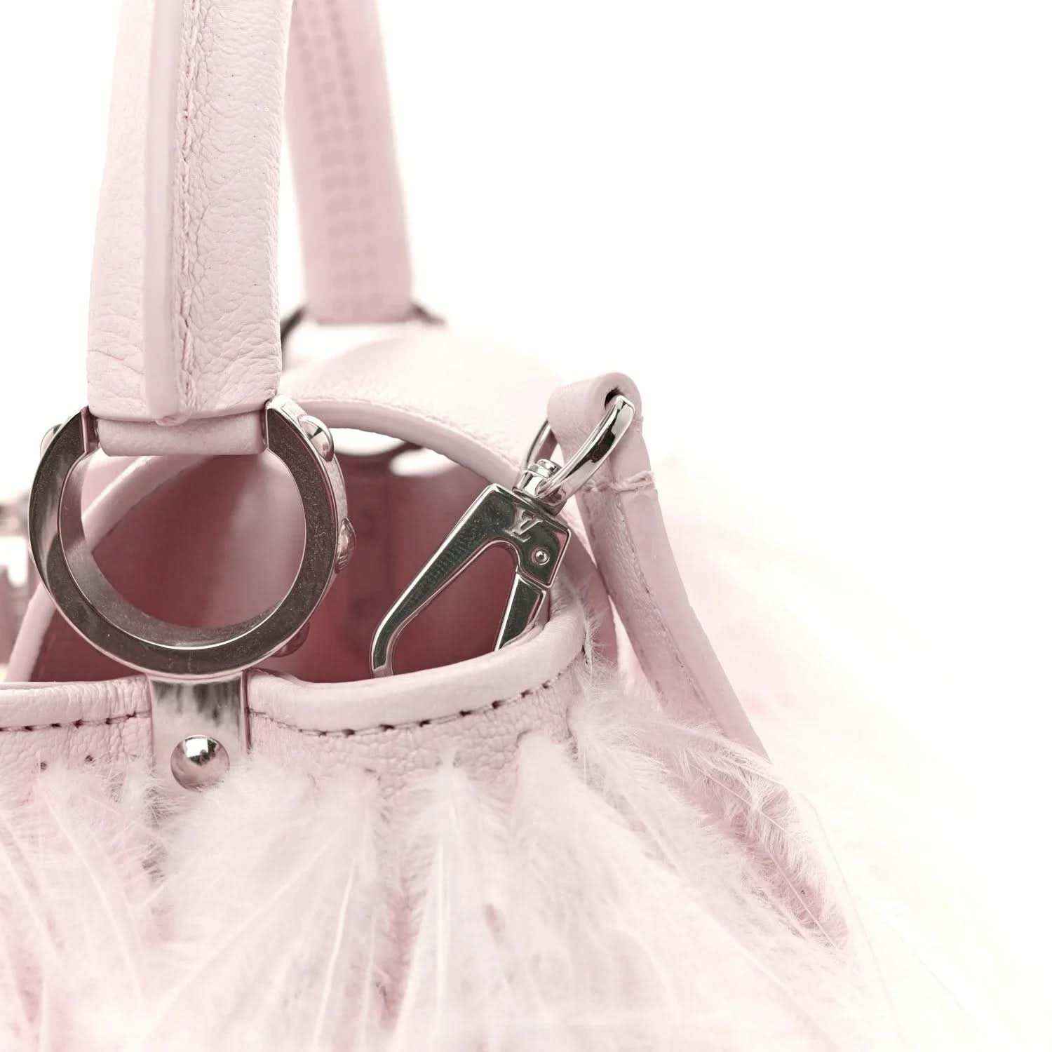Louis Vuitton mini top-handle bag with pale pink feather trim and metal handle rings