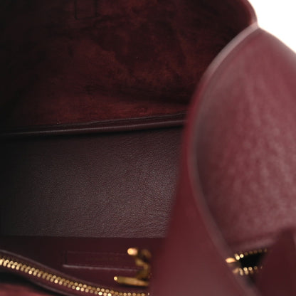 Burgundy leather interior with zip track and stitched pocket seam