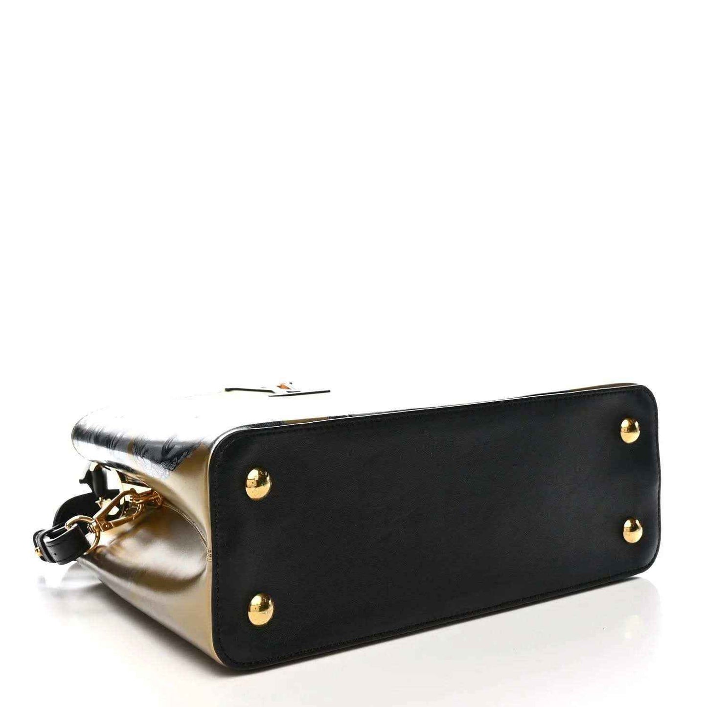 Leather handbag front with gold studs, black body edge trim, and gold side panel