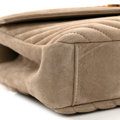 Taupe suede quilted bag close-up of side seam and structured bottom