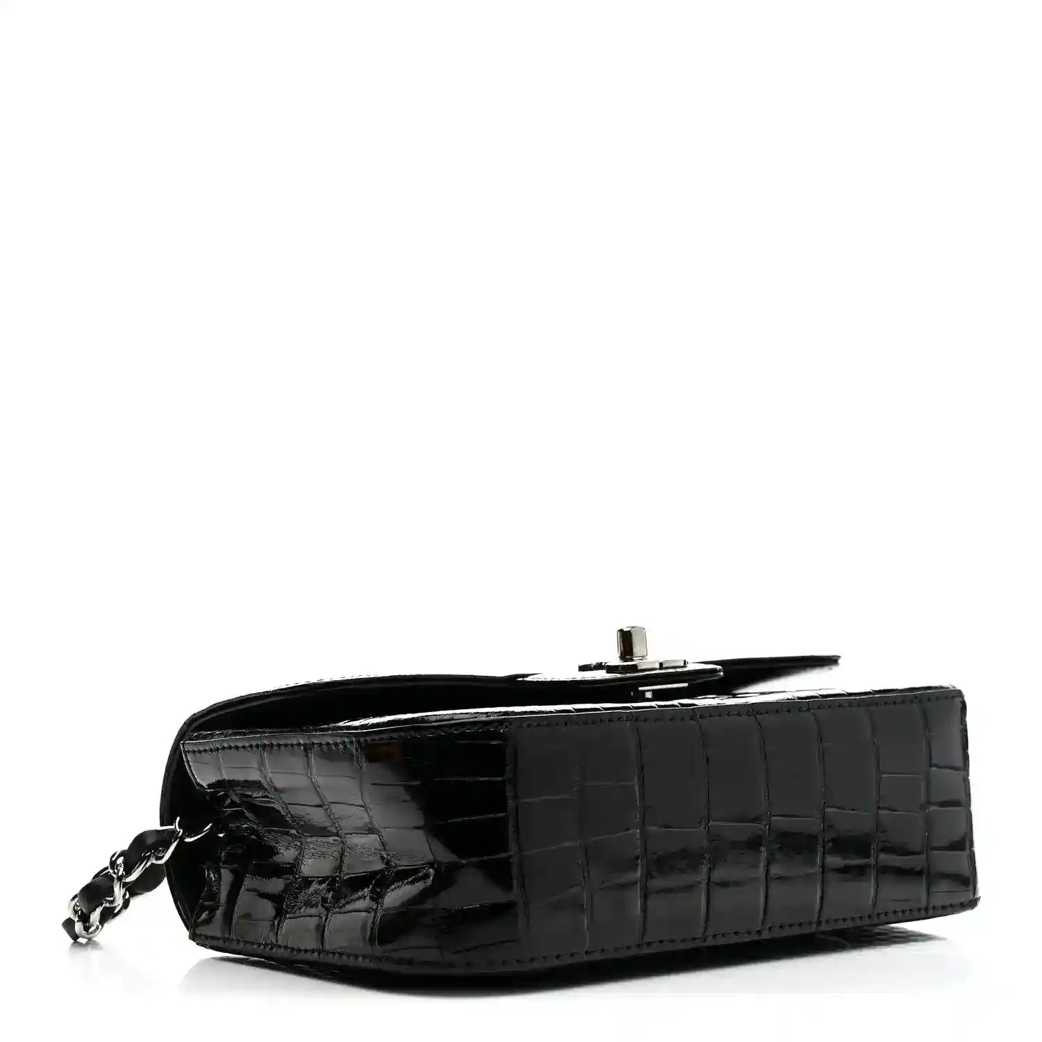 Black mini rectangular flap bag with glossy alligator texture and chain strap clasp.