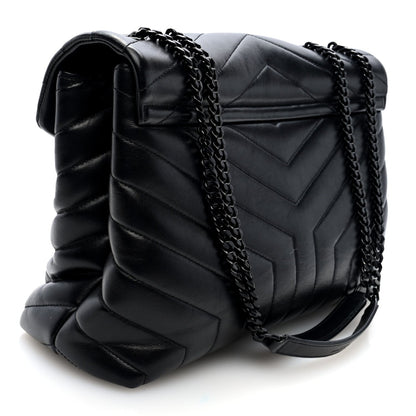 Black quilted calfskin satchel with chain strap and front flap, side view