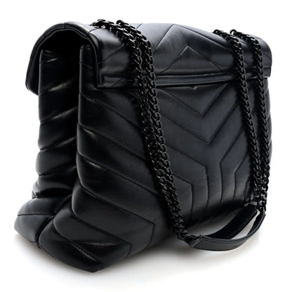 Black quilted calfskin satchel with chain strap and front flap, side view