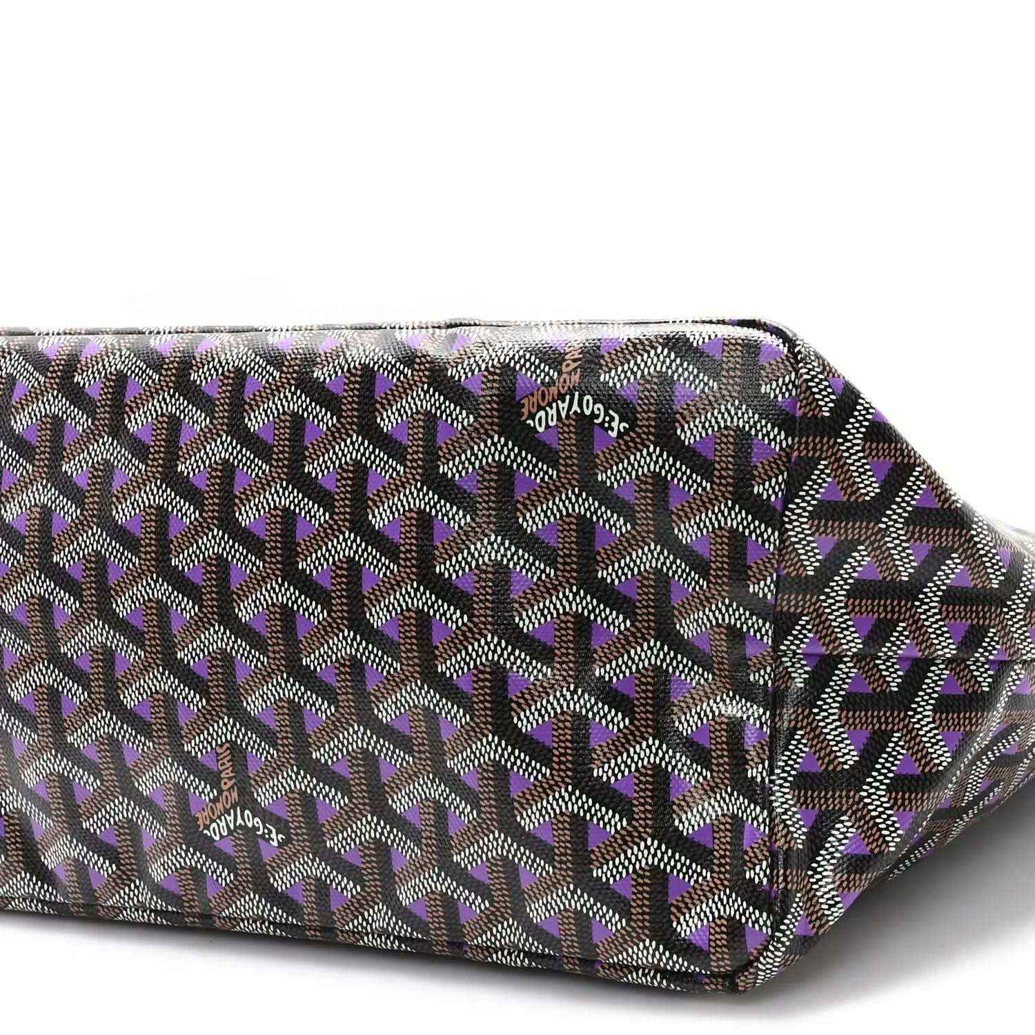 Tote bag with black and violet geometric patterned canvas, zipper top edge.