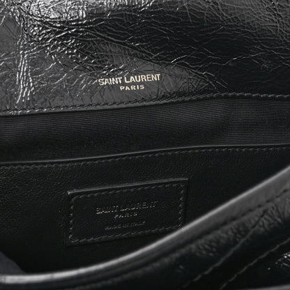 Black satchel interior with Saint Laurent Paris stamp on leather