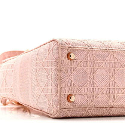 Pink canvas bag end with stitched panel and gold button closure