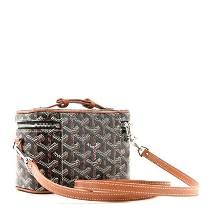 Mini vanity case with top handle and long crossbody strap; dark monogram canvas