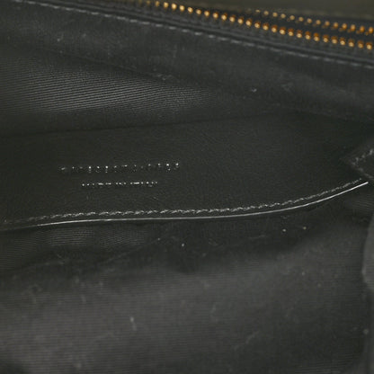 Black leather interior detail with zipper track and fine stitching lines