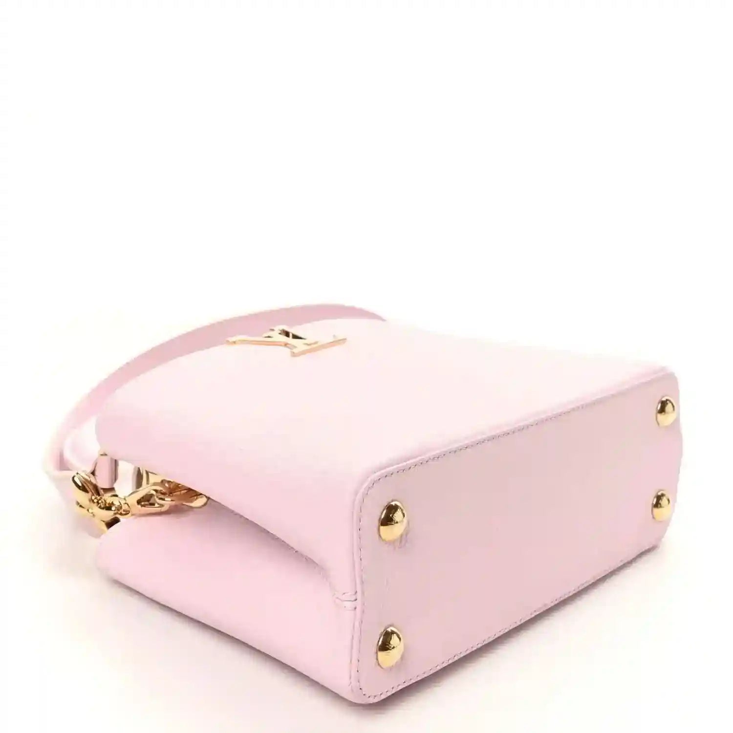 Guimauve pink leather handbag bottom view with gold feet and gold clasp hardware