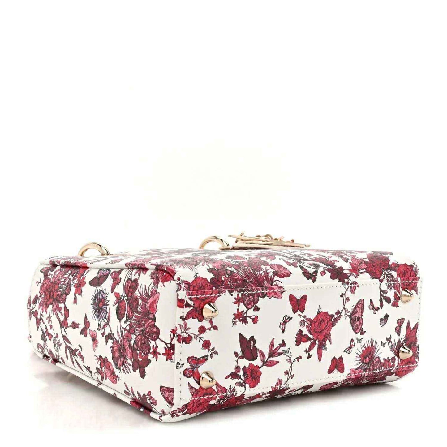 White and red floral handbag with top handle and structured flap front, gold-tone details