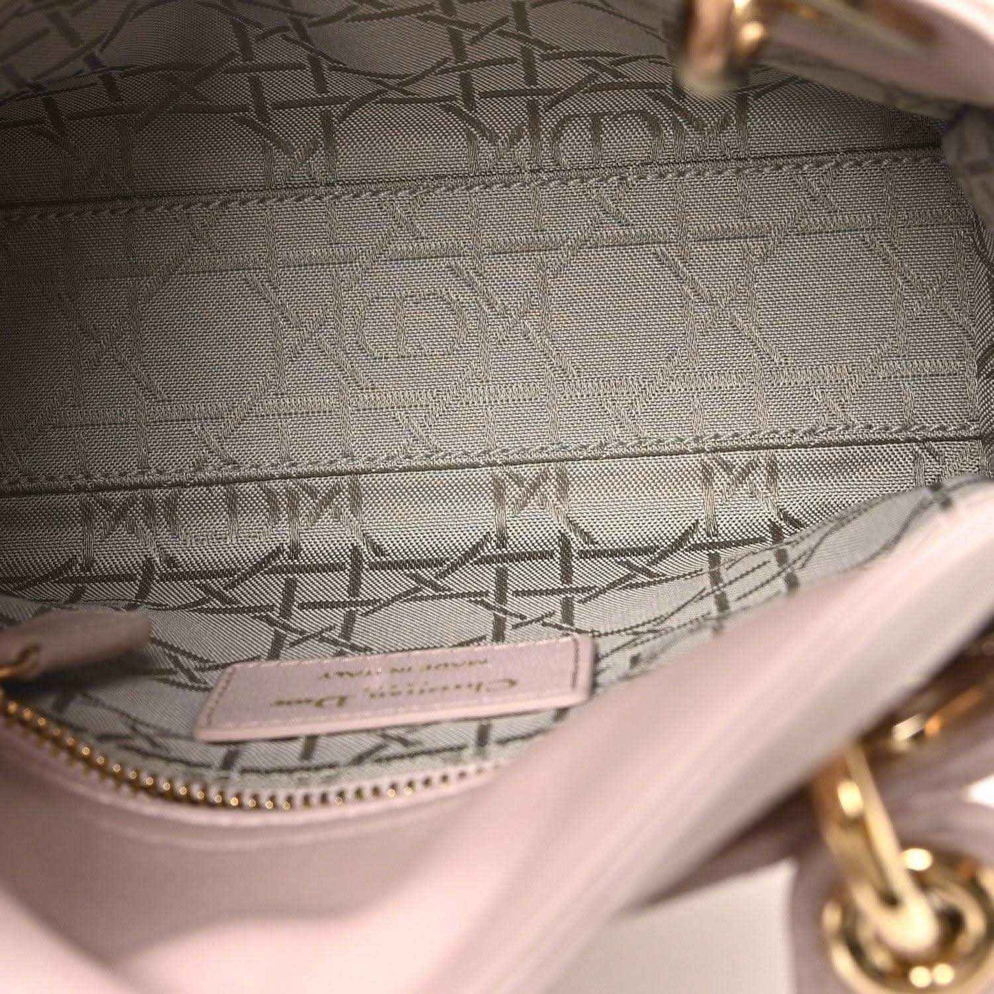 Mini Lady Dior handbag interior lining with logo patch and pink trim stitching