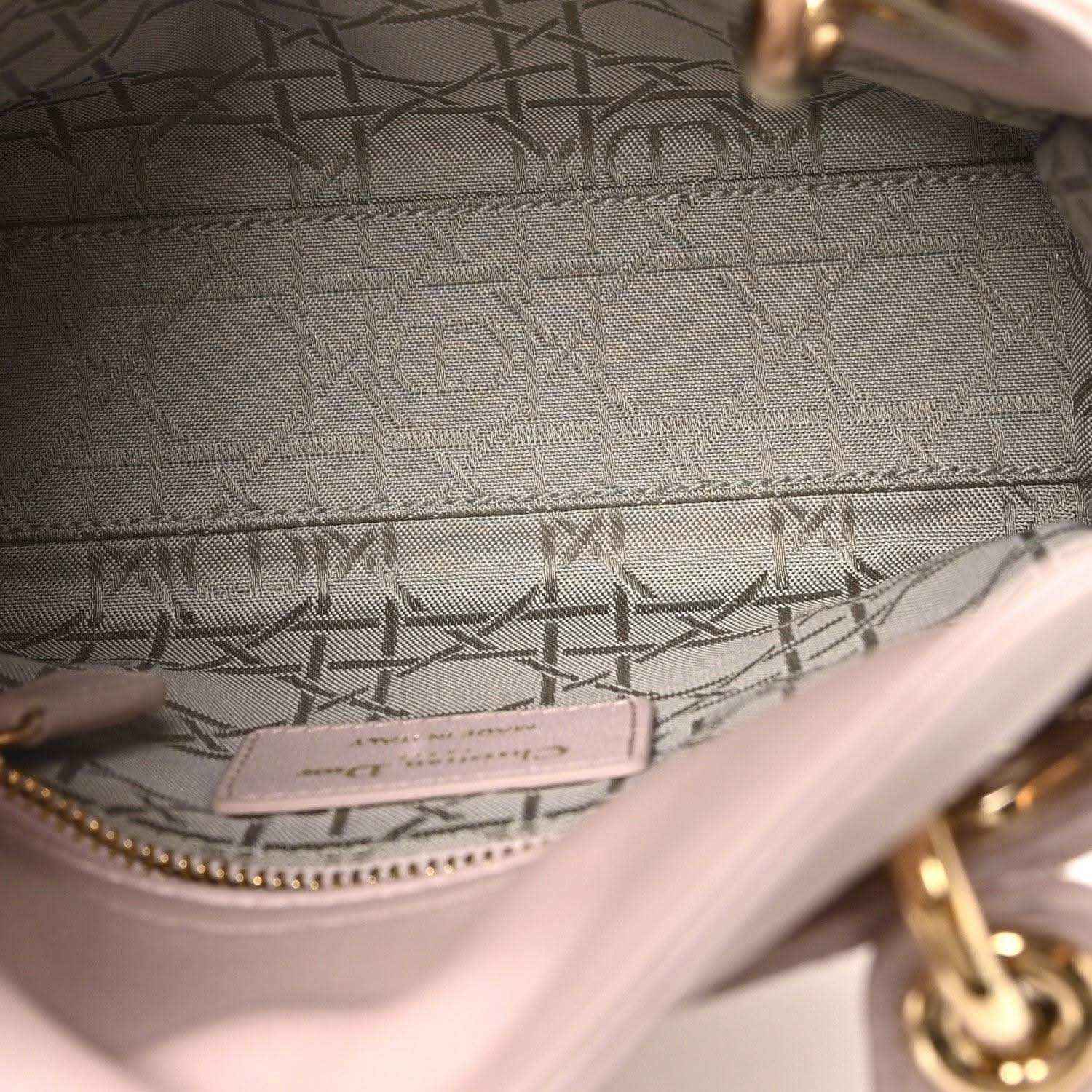 Mini Lady Dior handbag interior lining with logo patch and pink trim stitching