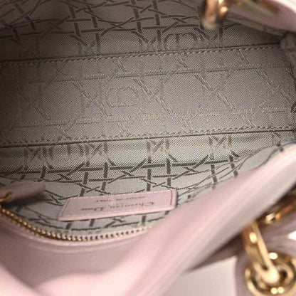 Mini Lady Dior handbag interior lining with logo patch and pink trim stitching