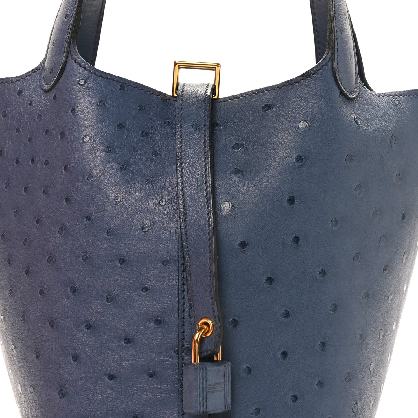 Blue ostrich leather bucket bag top with gold clasp and leather strap loop.