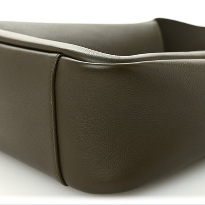 Calfskin hobo bag corner close-up showing smooth leather and rounded edge.