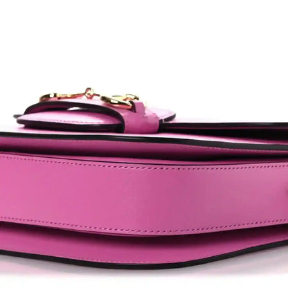 Gucci pink leather shoulder bag close-up of top hardware detail and stitching