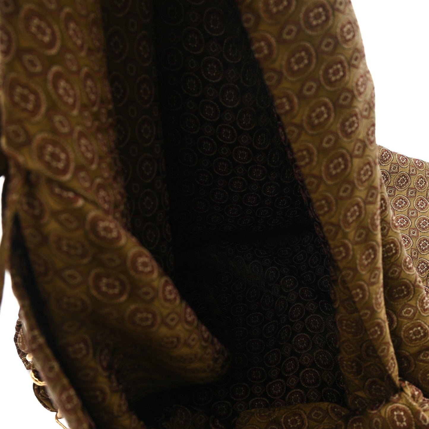 Hobo bag interior section with jacquard paneling and braided handle attachment, brown/olive.