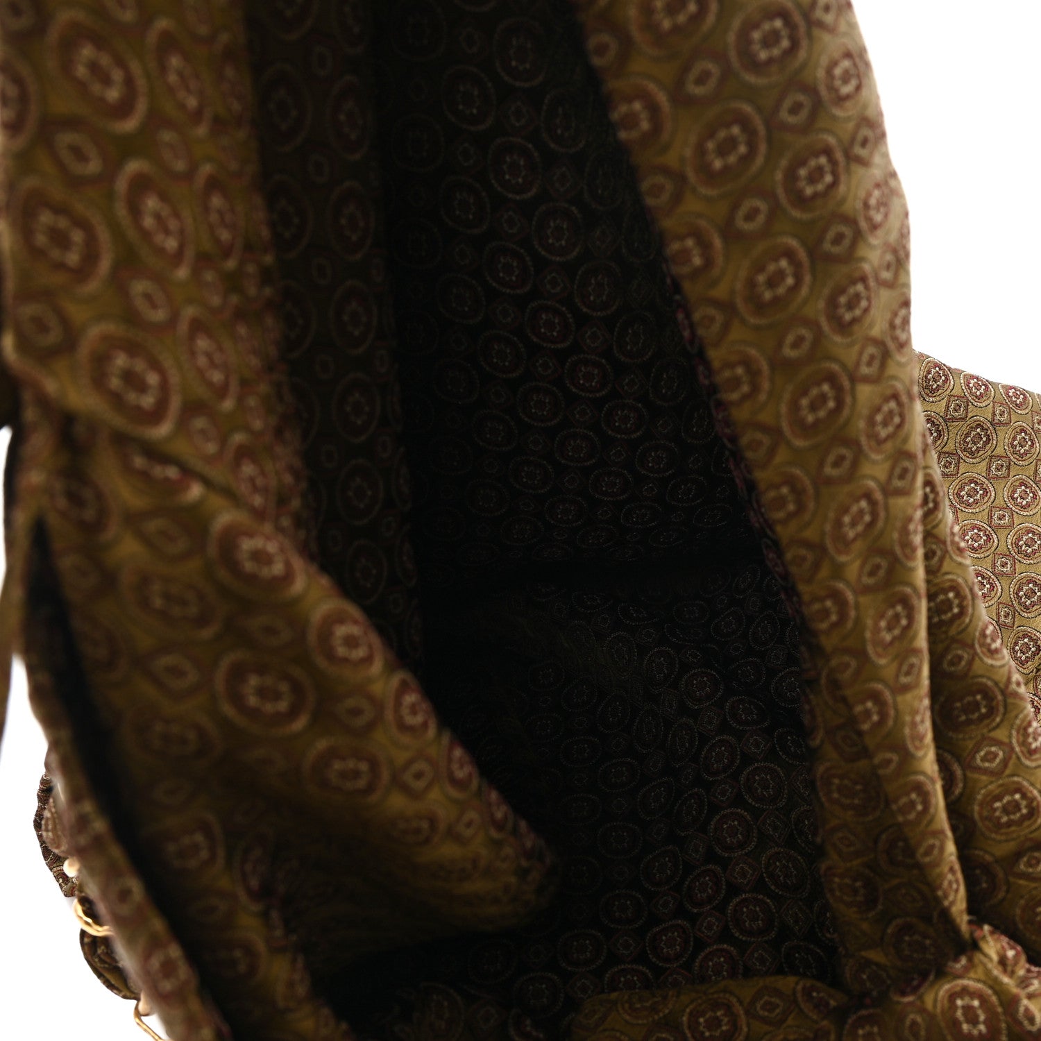 Hobo bag interior section with jacquard paneling and braided handle attachment, brown/olive.