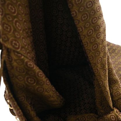 Hobo bag interior section with jacquard paneling and braided handle attachment, brown/olive.