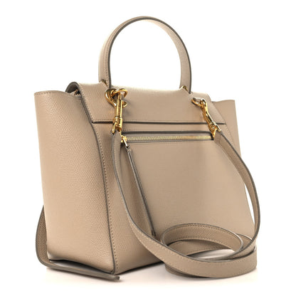 Celine light taupe micro belt bag with gold hardware, top handle, and front zip pocket
