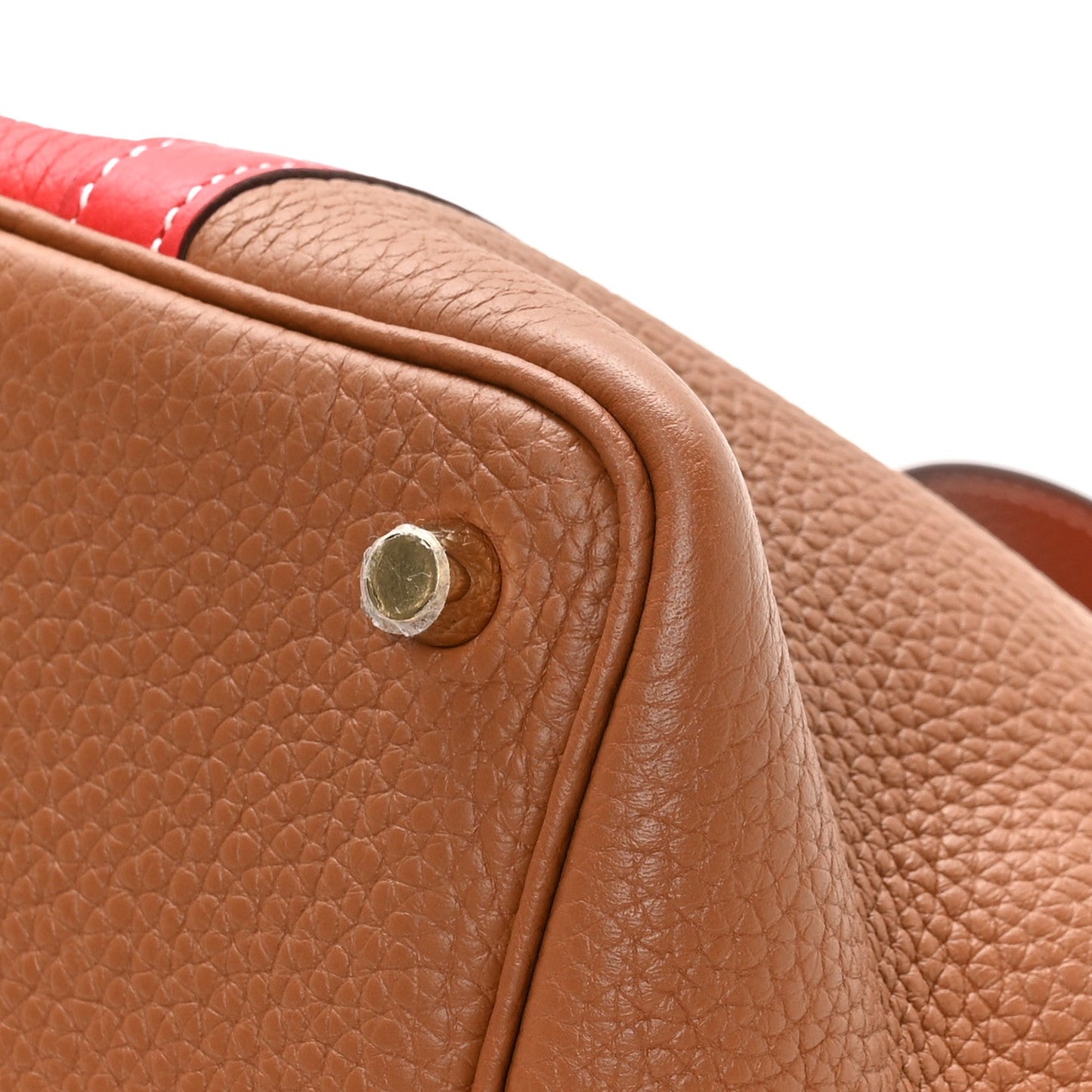Brown pebbled leather bag corner with round metal snap stud