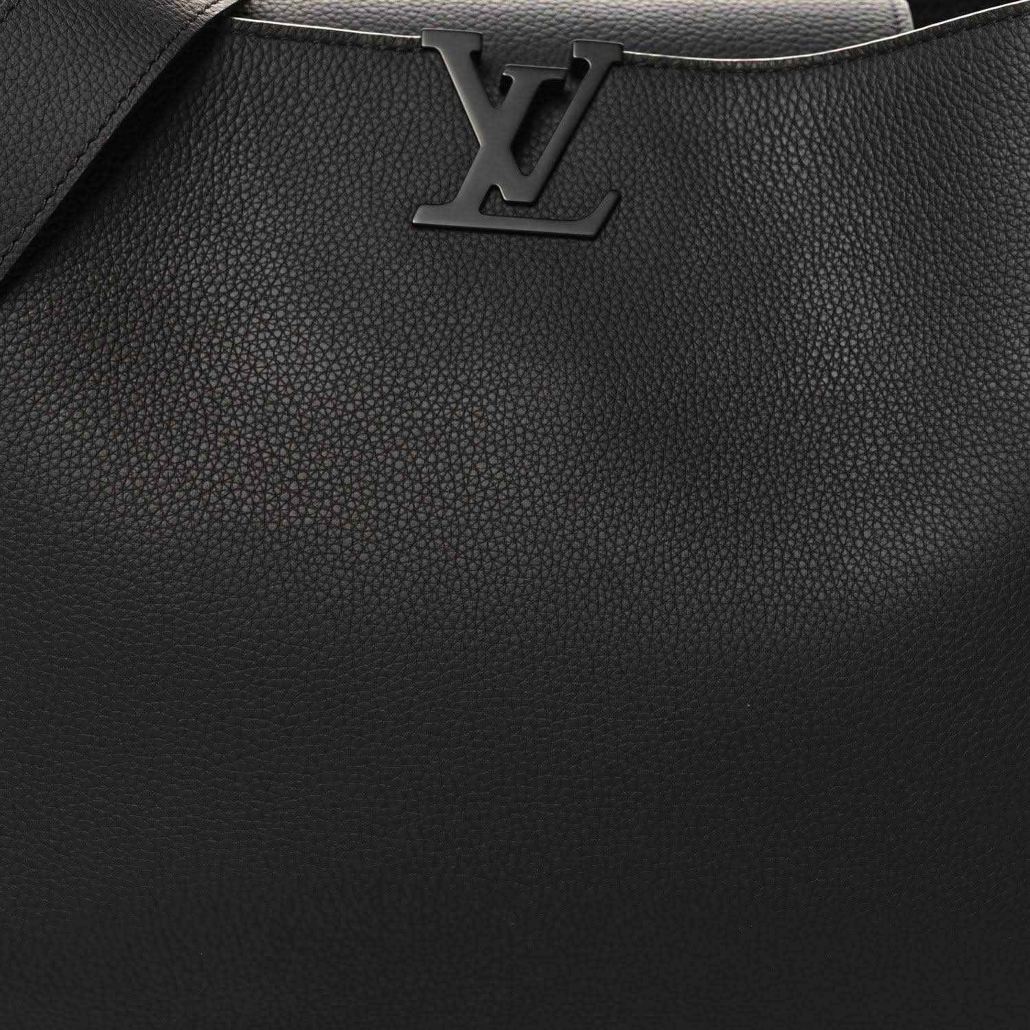 Black textured leather handbag front with LV logo and stitched trim