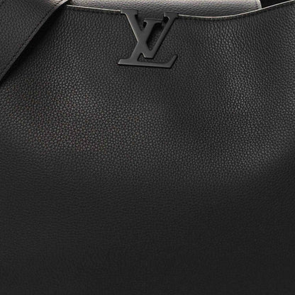 Black textured leather handbag front with LV logo and stitched trim