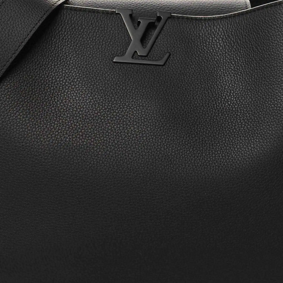 Black textured leather handbag front with LV logo and stitched trim