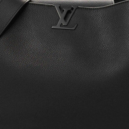 Black textured leather handbag front with LV logo and stitched trim