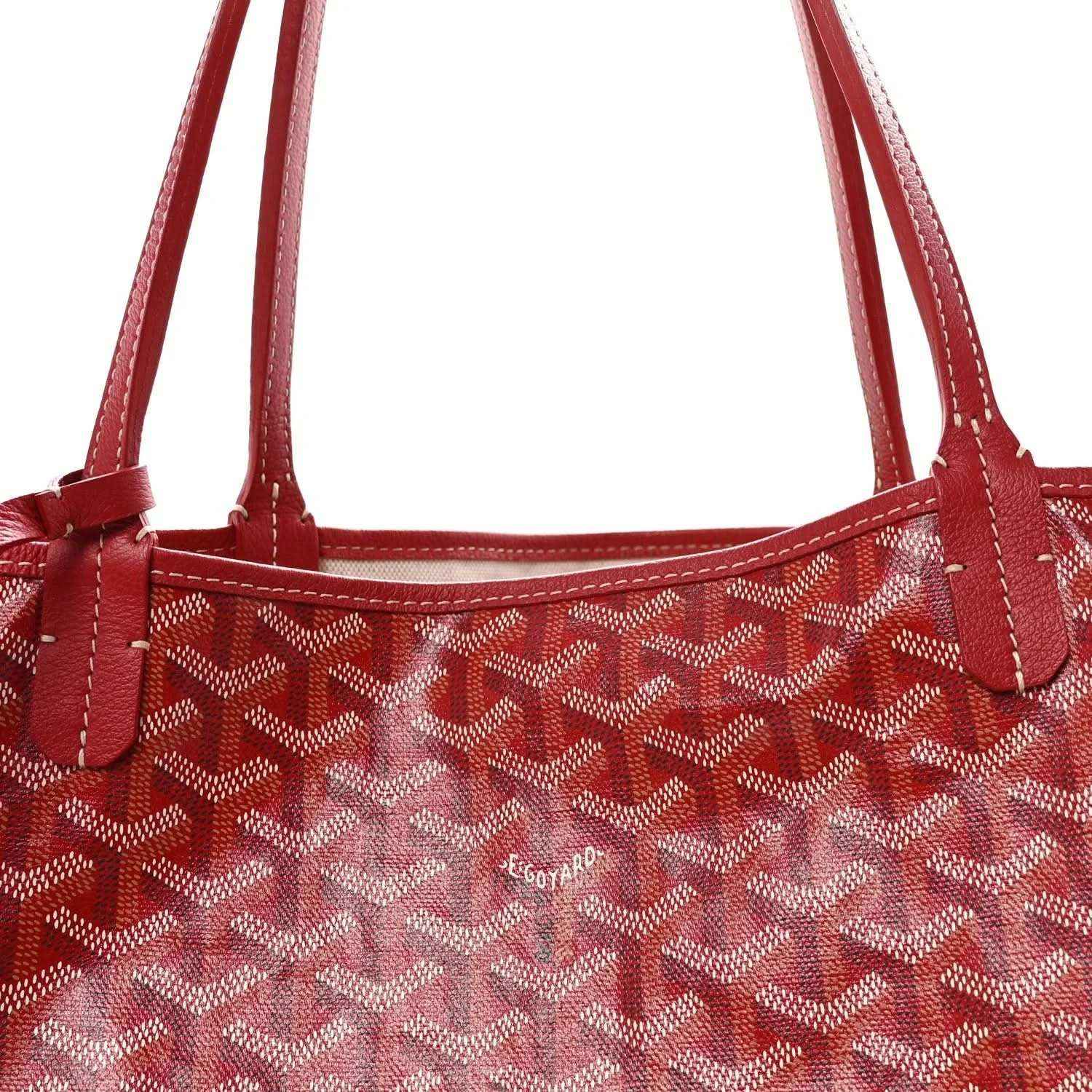 Red Goyardine canvas tote bag top with dual handles and logo patch.