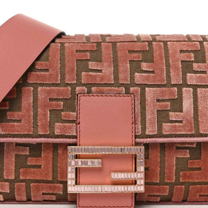 Front detail of pink velvet jacquard baguette bag with square leather patch and crystal FF