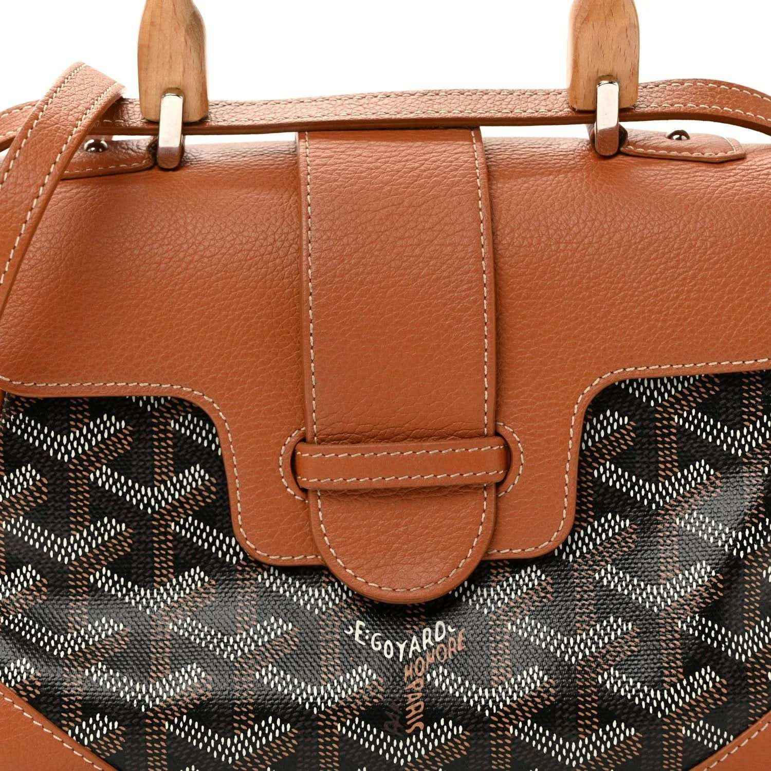 Mini Saigon bag front close-up, brown flap with patterned canvas panels and leather strap
