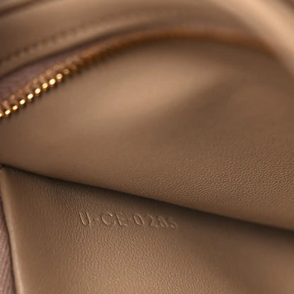 Close-up of embossed leather stamp on the bag interior