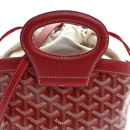 Red mini handbag opening with drawstring and Goyardine pattern, top handle loop