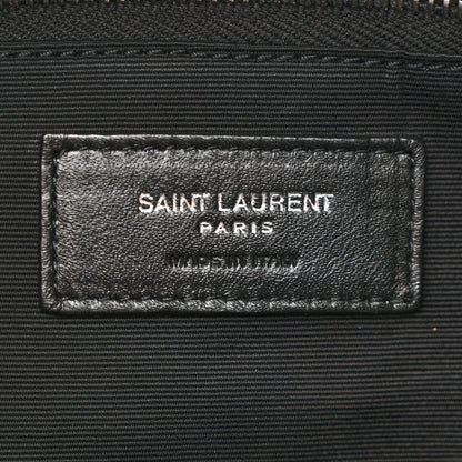 Saint Laurent Paris leather label on black satchel interior lining