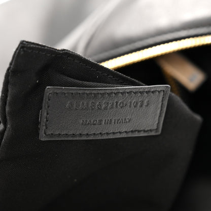 Made in Italy leather label on black hobo bag with gold zipper edge