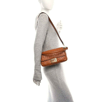 Fendi baguette bag with adjustable shoulder strap, tan embossed leather and gold buckle