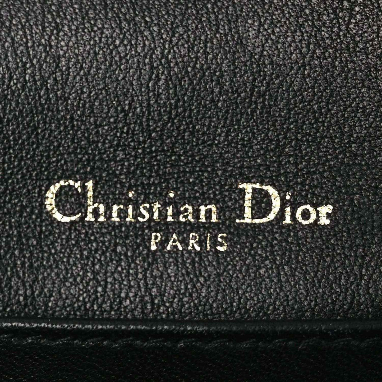 Black leather Lady Dior pouch lining label reading Christian Dior PARTS