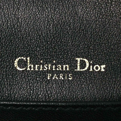 Black leather Lady Dior pouch lining label reading Christian Dior PARTS