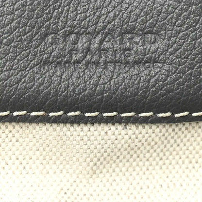 Grey leather trim and textured surface on hobo bag with white edge stitching