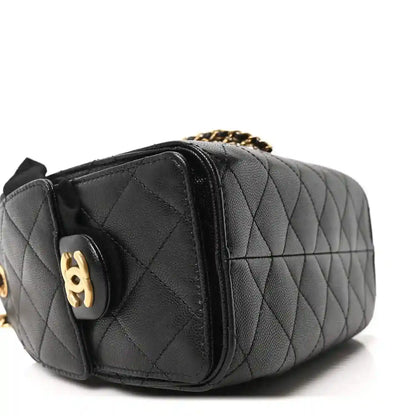 Black leather quilted mini handbag side panel with gold-toned CC emblem