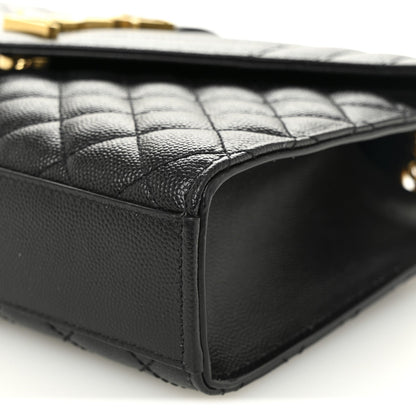 Black leather satchel corner with quilted panel and stitched edge