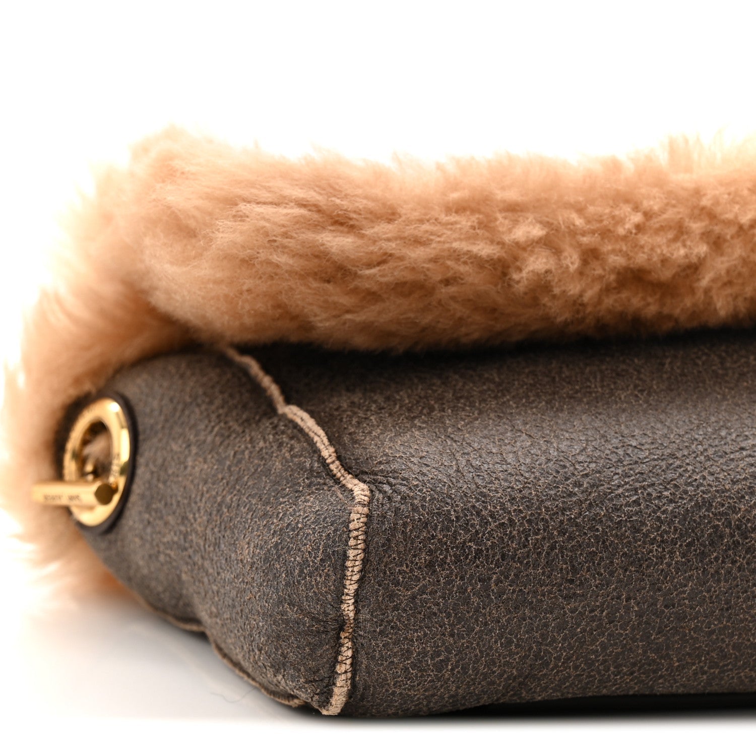 Saint Laurent reversible satchel with dark brown leather side and round gold logo clasp